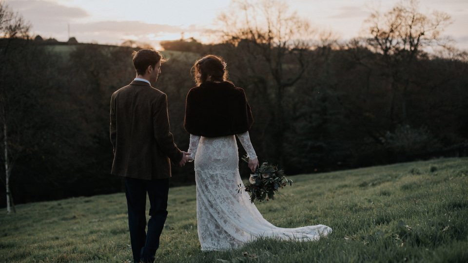 Bride and groom in the hills in Cornwall during their winter wedding