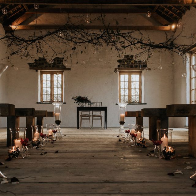 Picture of the wedding ceremony area in one of the barns at Launcells Barton in Cornwall. This picture was taken during a wedding planned by Jenny Wren, Wedding Planner in Cornwall.