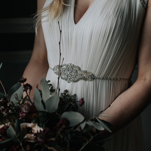 Styled photo of a bride with her bouquet at a wedding in Cornwall. This wedding was planned by Jenny Wren, wedding  and event planner in Cornwall