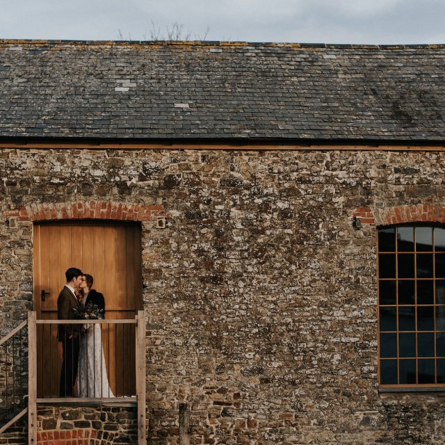 Photo of the bride and groom during a wedding at Launcells Barton in Cornwall. This wedding was planned by Jenny Wren, wedding  and event planner in Cornwall