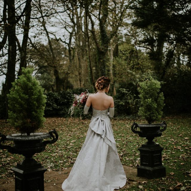 A bride outside at the Wedding Venue during her wedding in Cornwall. This wedding was planned by Jenny Wren, wedding  and event planner in Cornwall